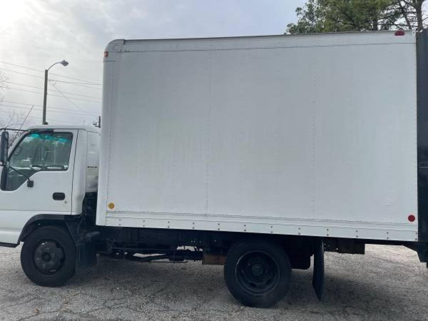 1999 white /gray Isuzu NPR (4KLC4B1R8XJ) with an 5.7 GAS V8 engine, Auto transmission, located at 5700 Curlew Drive, Norfolk, VA, 23502, (757) 455-6330, 36.841885, -76.209412 - -1999 Isuzu NPR 61k -Ready to work! -V8 gas motor -6 like new tires with great tread -12 ft box with roll up door -Tommy gate has been removed -No issues, runs and drives great -New state inspection -VADLR $250 processing fee. No other dealer fees. - Photo#9